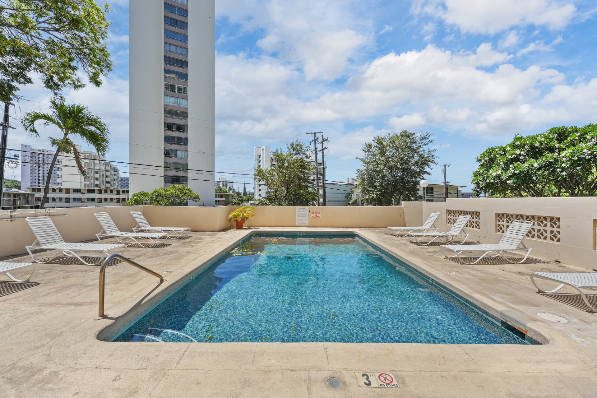 Pool with tower and treetops in the background