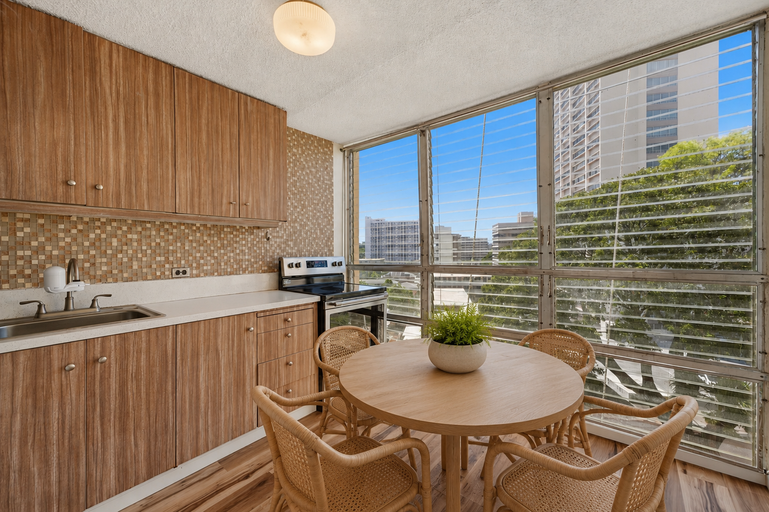 Refreshed kitchen with electric range and city view