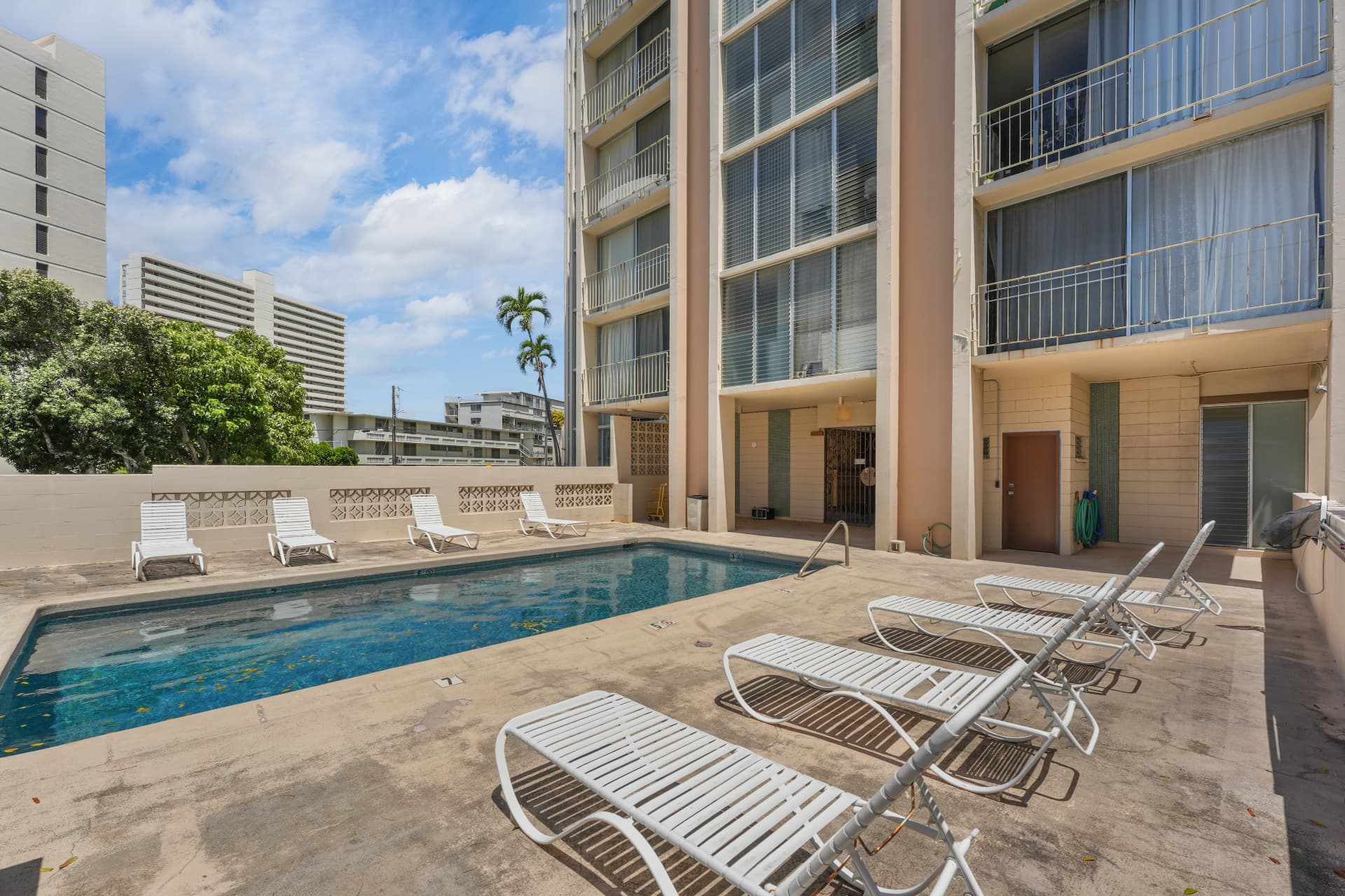 Pool deck alongside Hale O Kalani Towers building