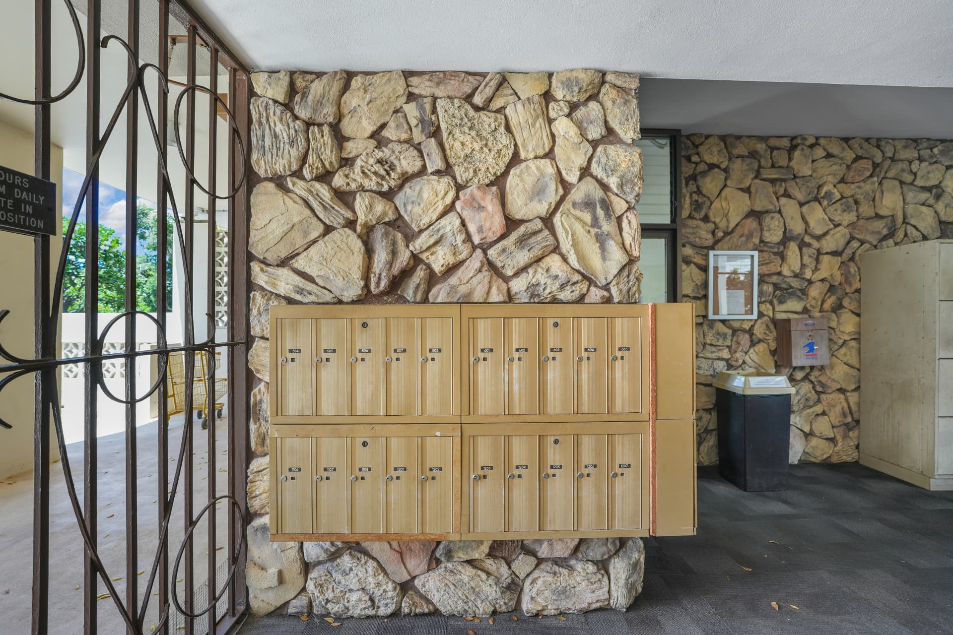 Building lobby with stone wall and resident mailboxes